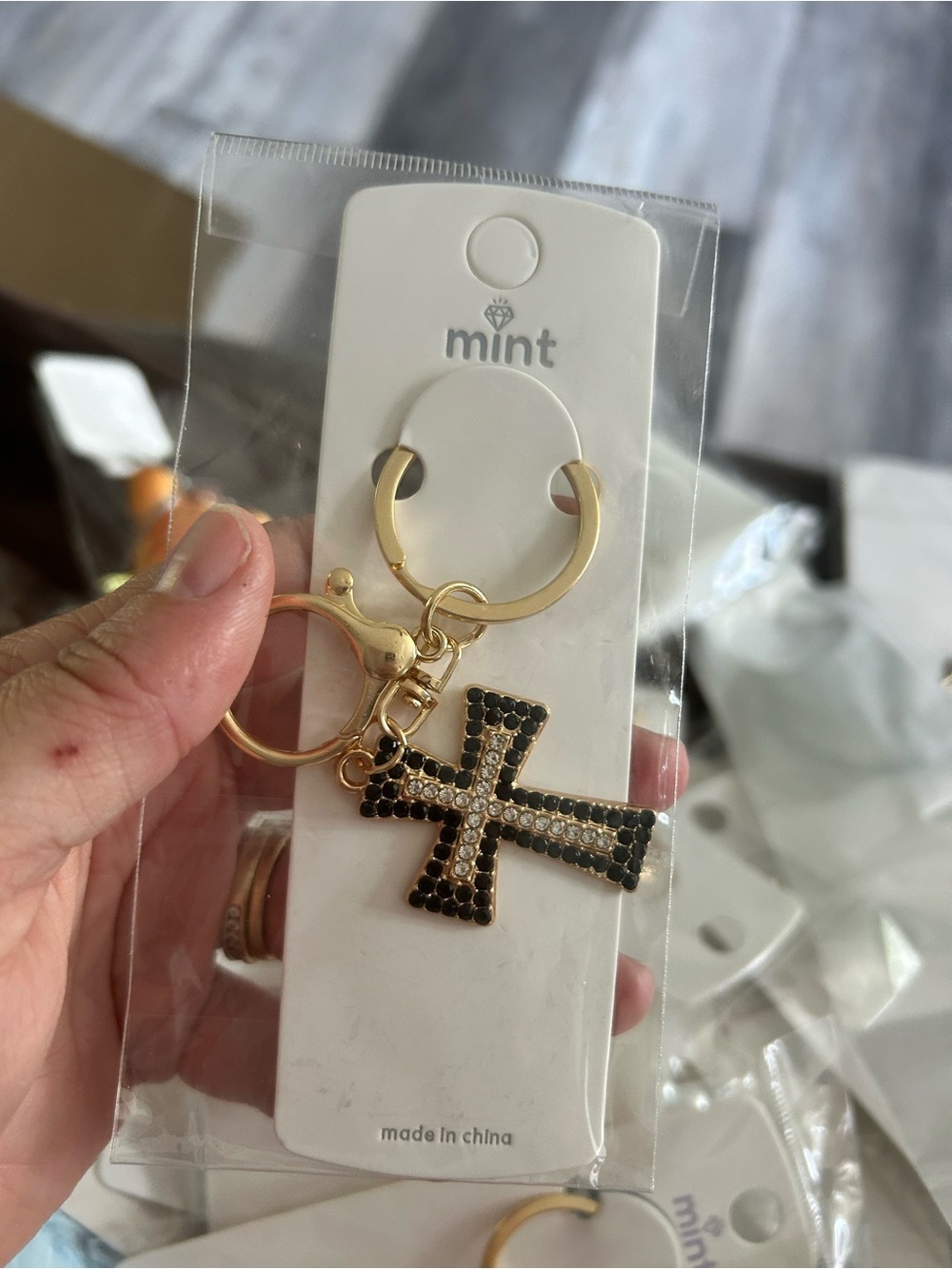 4/$50 Mint Gold Keychain with Black Crystal Cross Charm